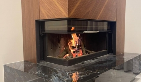 Corner Wood Fireplace by Hitze